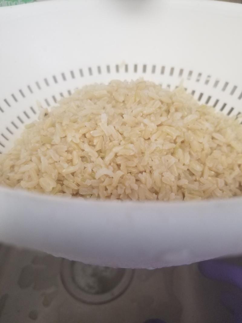 https://www.amysnutritionkitchen.com/wp-content/uploads/2021/05/Brown-Rice-Drain-extra-water-1.jpg