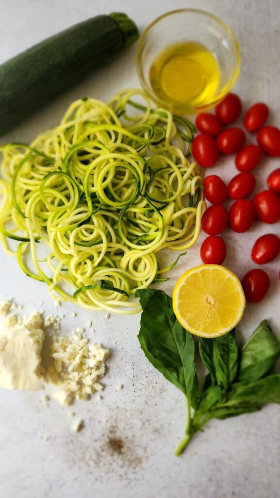 Zoodle Salad - Ingredients: Zucchini, Tomatoes, Basil, Black Pepper, Olive Oil, Lemon Juice