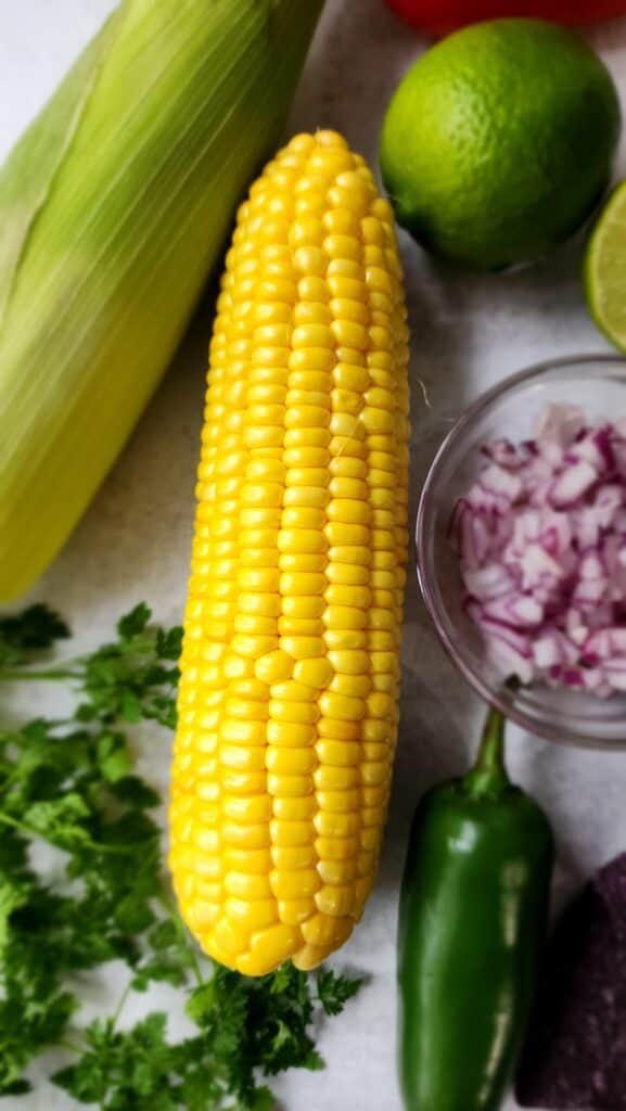 ingredients for easy corn salsa highlighting the corn on the cob