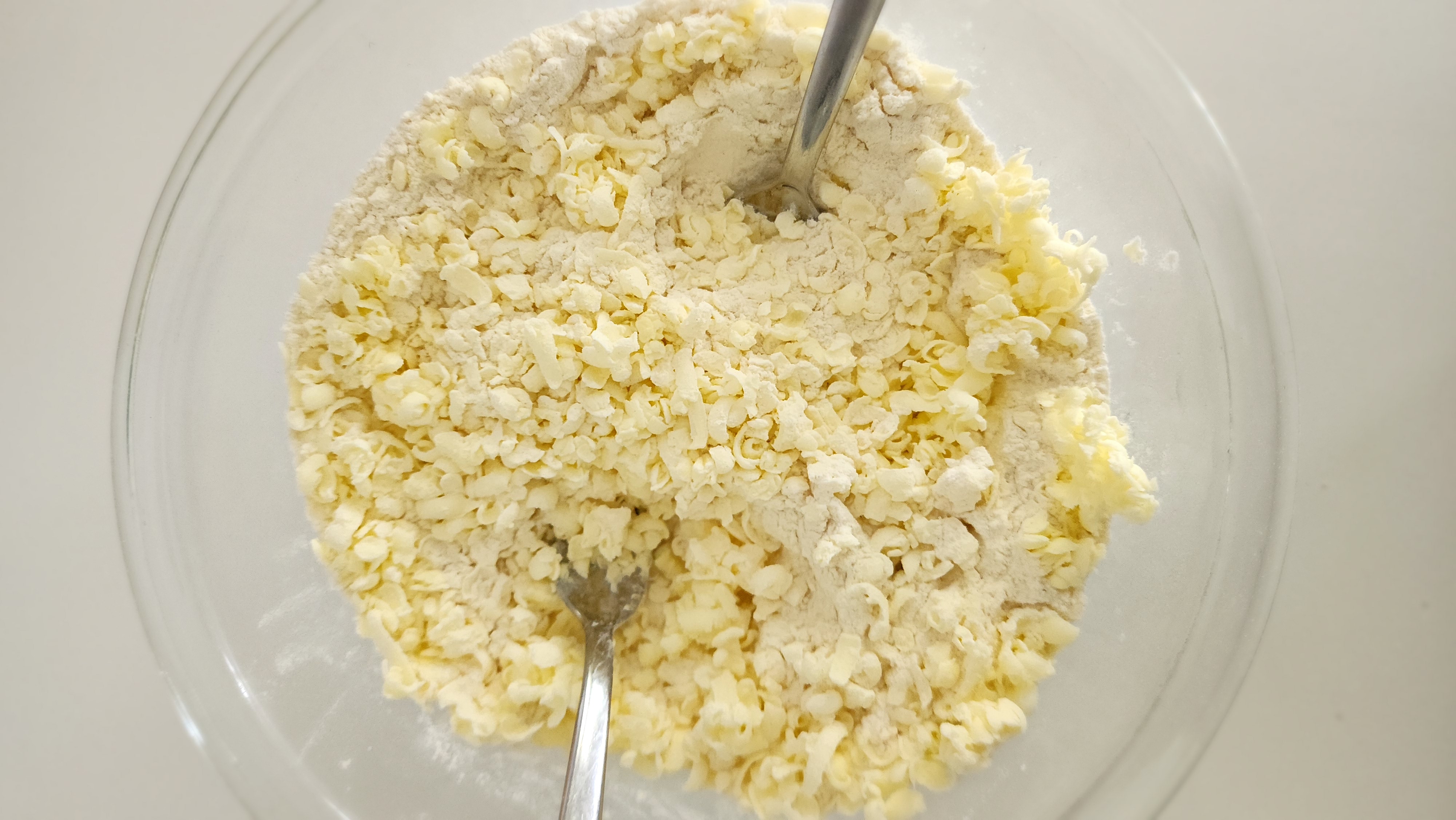 Butter mixed into flour for buttermilk biscuits