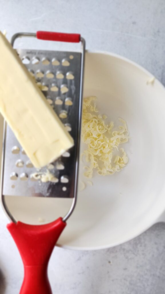 Grating Frozen Butter with a hand grater