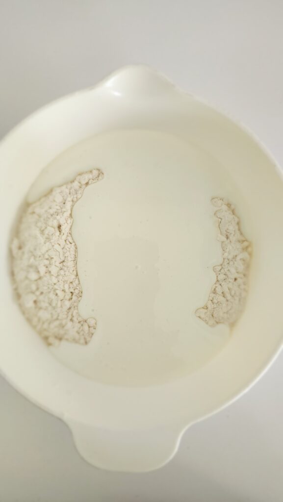 Buttermilk and flour ready to be mixed for buttermilk biscuits