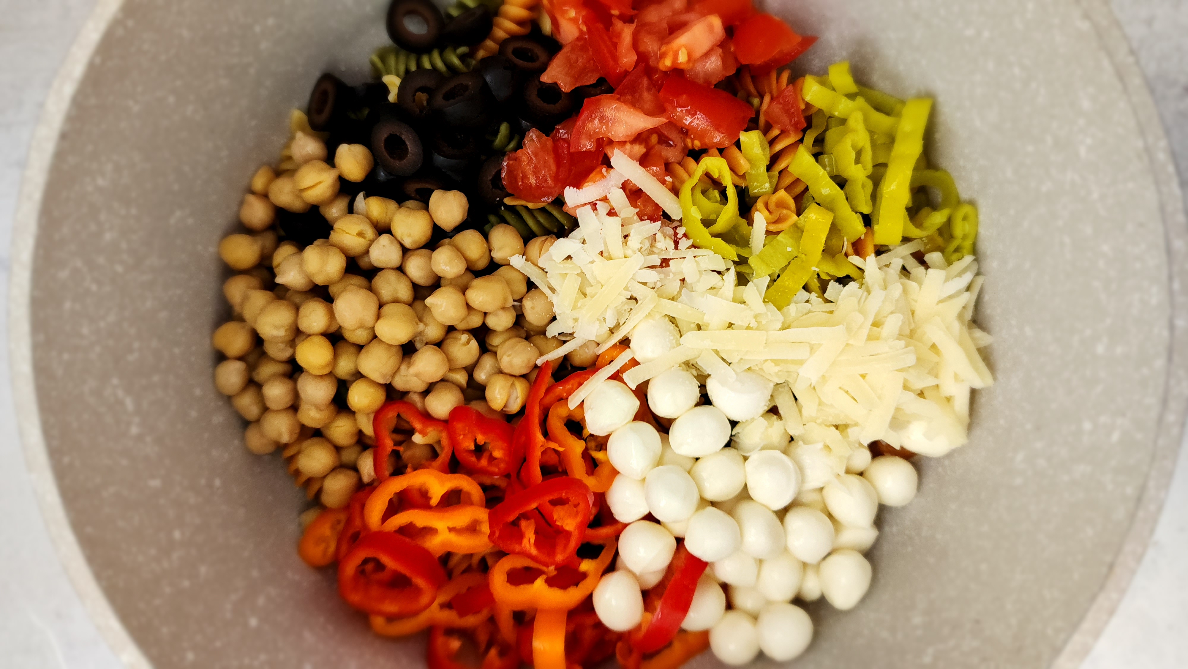 'Italian' Pasta Salad - all the ingredients added to a mixing bowl