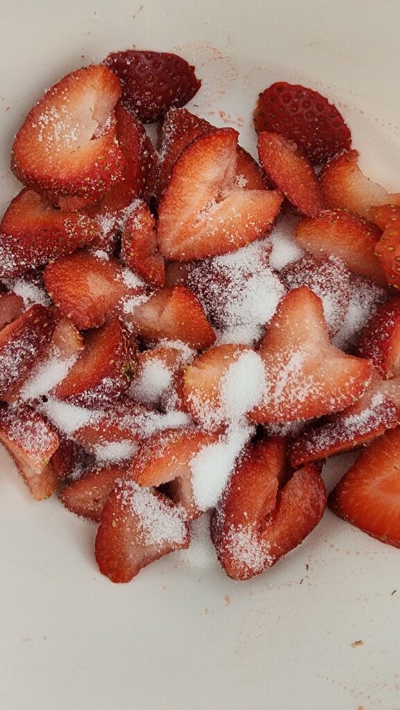 sliced strawberries sprinkled with sugar