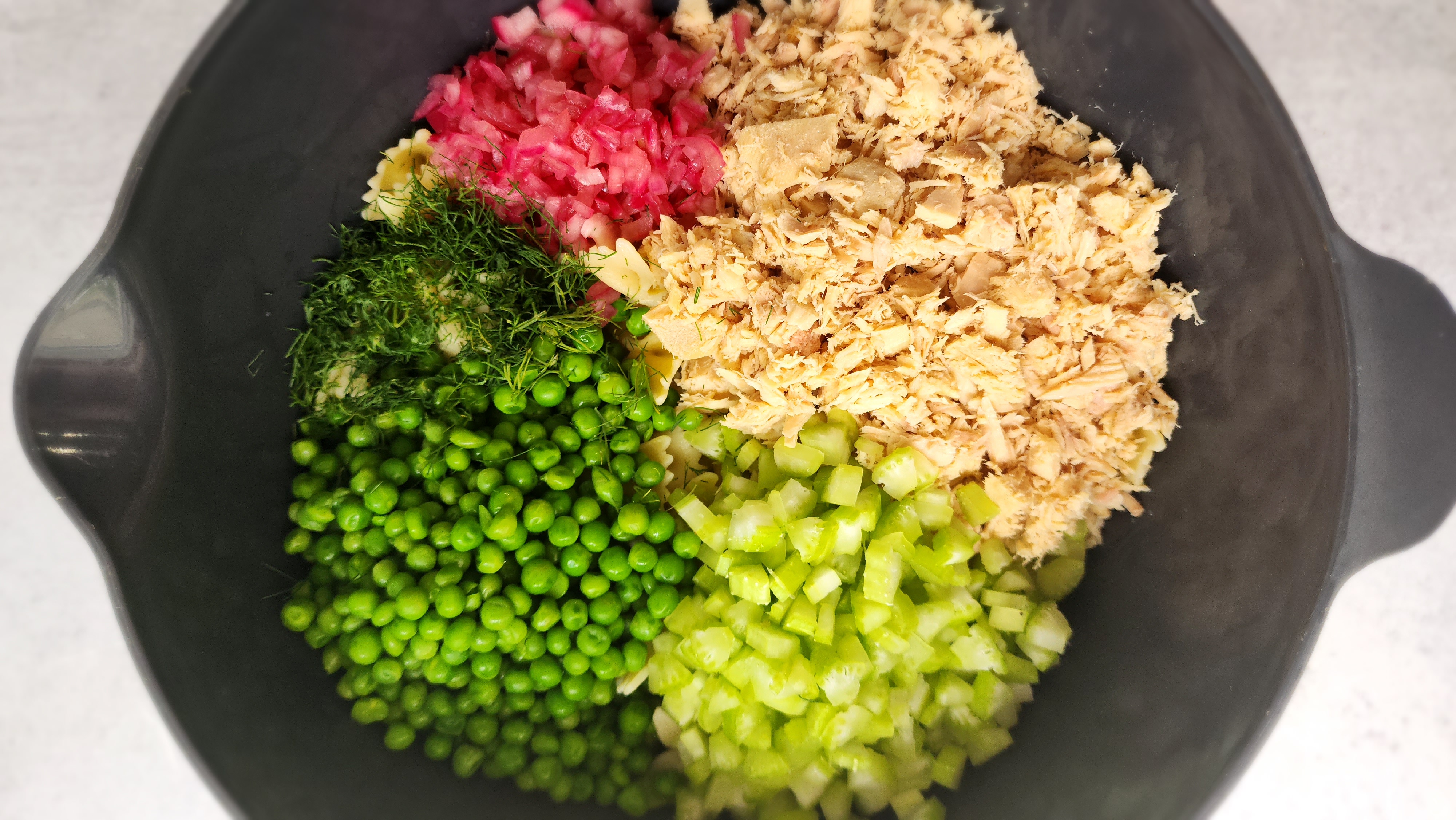 Tuna Pasta Salad - All Ingredients in a bowl ready to add dressing