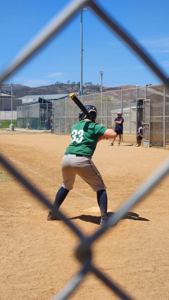 Joshua hitting in a baseball game