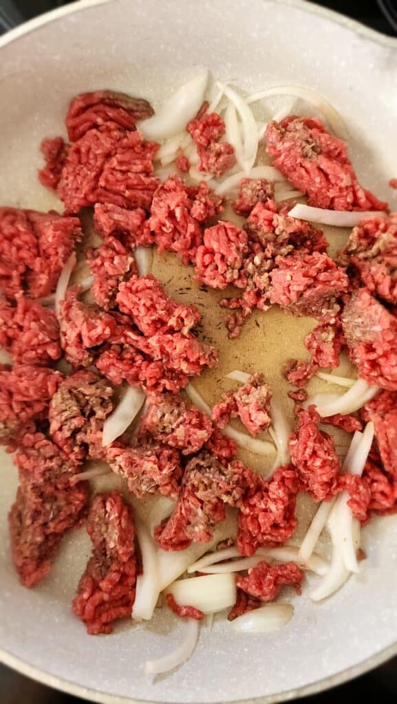 Ground beef and onion cooking in a pan