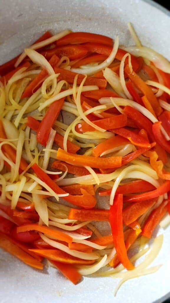 close up of sauteed peppers and olives