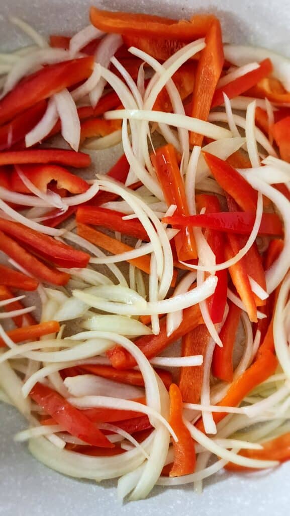 cut onions and peppers ready to saute