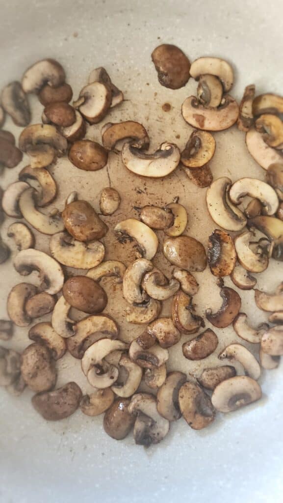 Sauteed mushrooms in a frying pan