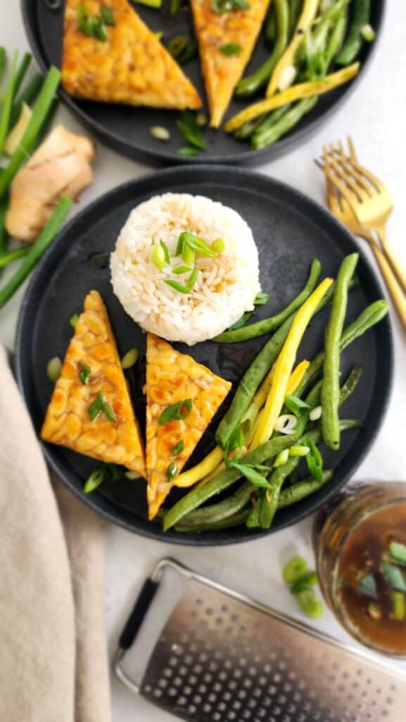 sauteed tempeh, white rice, and roasted green beans with sesame ginger sauce