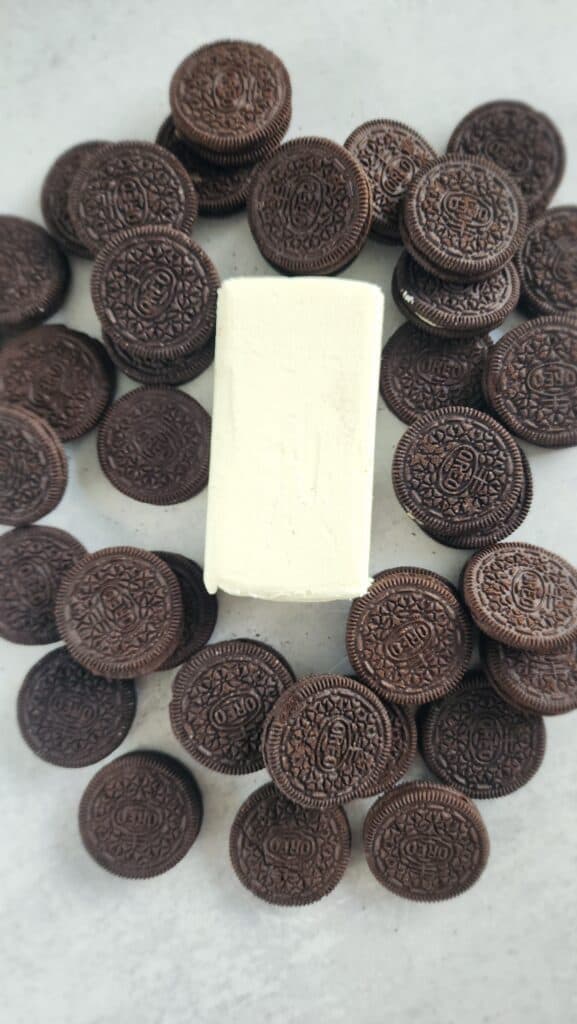 block of cream cheese with Oreos